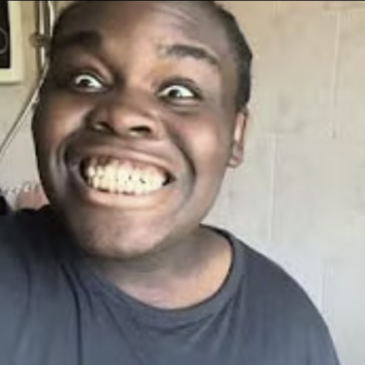 Tunde smiling