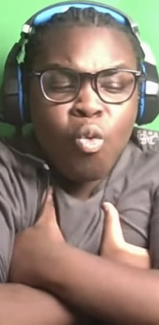 Tunde on stream wearing headphones